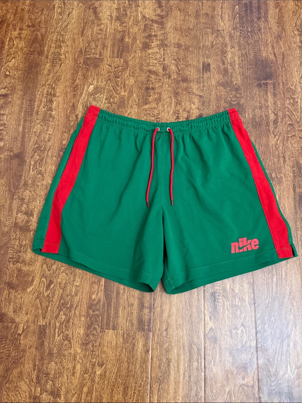 Nike Green Athletic Shorts with Red Accents